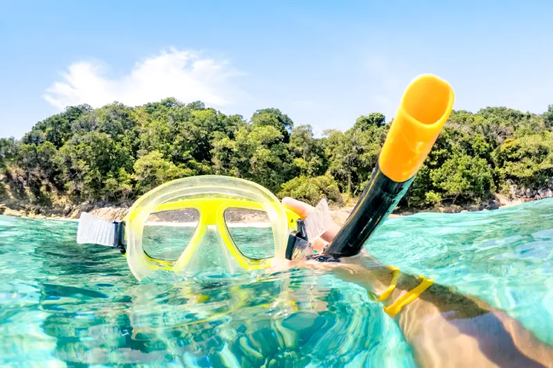 adventurous-guy-taking-photo-of-snorkeling-mask-un-2024-07-03-02-44-12-utc.webp